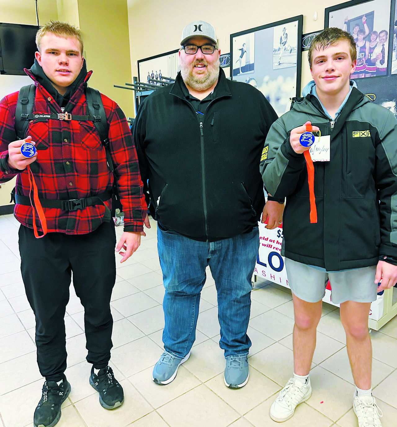 North Border Grizzles coach Mitch Greenwood scored his 250th career win at the meet in Hillsboro on Dec. 7. Zeke Symington and Kayden Rose were recognized as medalists for achieving records of 4-0 for the tournament. Submitted Photo.
