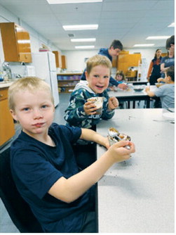 One group of parenting students taught preschoolers how to make dirt cups as part of a final project exploring fun summer activities that don't involve screens. The day also included scavenger hunts and fort building. Submitted photo
