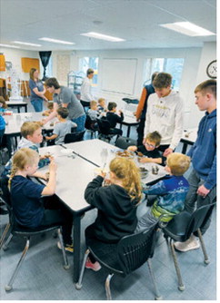 Students and preschoolers share smiles while enjoying dirt cups created during a hands-on activity led by North Border’s parenting class. The project encouraged creativity, teamwork and screen-free fun. Submitted photo