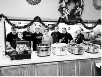 Pictured are members of the Langdon Area Chamber of Commerce board, who put on the Mingle Jingle Brunch: Dave Bakke, Brandi Mittleider (executive director), Ryan Beattie, Annamarie Lill, Morgan Zeis, Sarah Mikkelson, Kayce Schlittenhard, and Courtney Krom. Submitted photo.