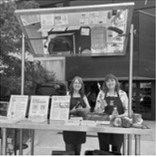 Julie Garden-Robinson, NDSU Extension food and nutrition specialist, and Beth Dahl, grant coordinator, share a cooking demo at the Red River Market. (NDSU photo)