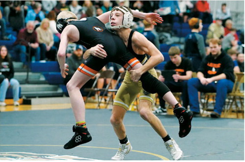 Collin Longtin in action at the wrestling tournament in Walhalla went on to pin his opponent on Feb. 7. Photo by Larry Stokke