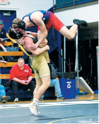 Aiden Werner took his opponent off his feet and finished the match winning by a pinfall in Walhalla on Feb. 7. Photo by Larry Stokke