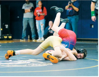 Johnny Robinson pinned his MPCG opponent in 35 seconds. Photo by Larry Stokke
