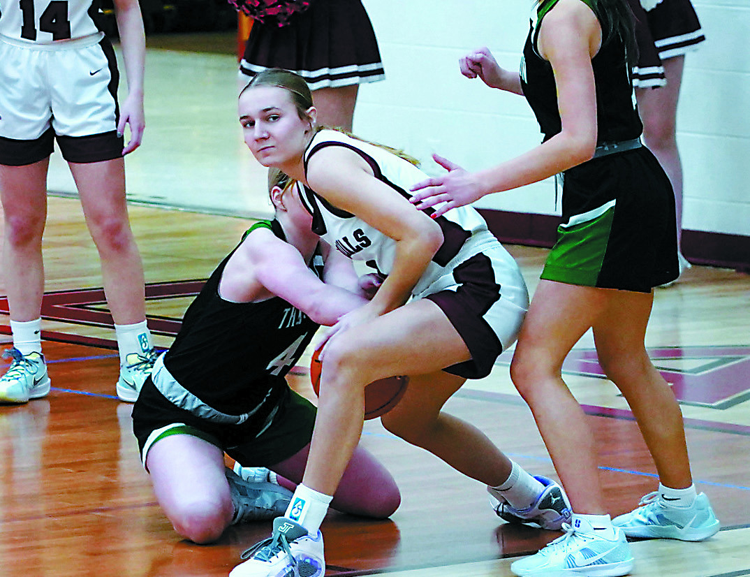Kemi Morstad tangles with the Tommies’ Jadeyn Albrecht for a loose ball. Photo by Larry Stokke. Mikaela Olson gets fouled going up for a shot, sending her to the free throw line where she drained a basket. Photo by Larry Stokke.