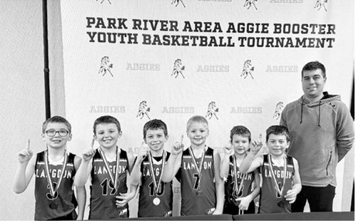 Langdon first grade boys did well at the Park River Area Aggie Booster Youth Basketball Tournament on Jan. 24, winning the second grade division of the 3-on-3 tournament. Pictured L-R Laetyn Schaefer, Ben Schaefer, Emmit Roy, Lane Moline, Jensen Flink, Ivan Roy, and Coach Anthony Roy. Submitted photo