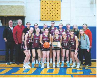 The Lady Cardinals celebrate their runner-up trophy in the District 4B championship. Photo by Larry Stokke