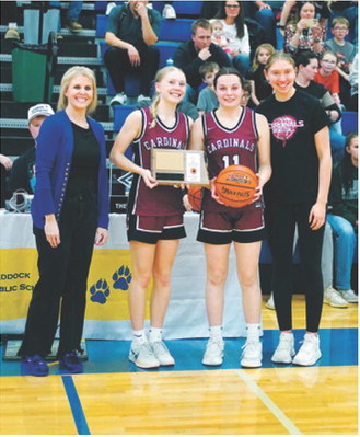 Cardinal teammates Hilary Haaven, Erika Bakke, and Aubrey Badding accept the 2nd Place Plaque at the District 4B Tournament. Photo by Larry Stokke