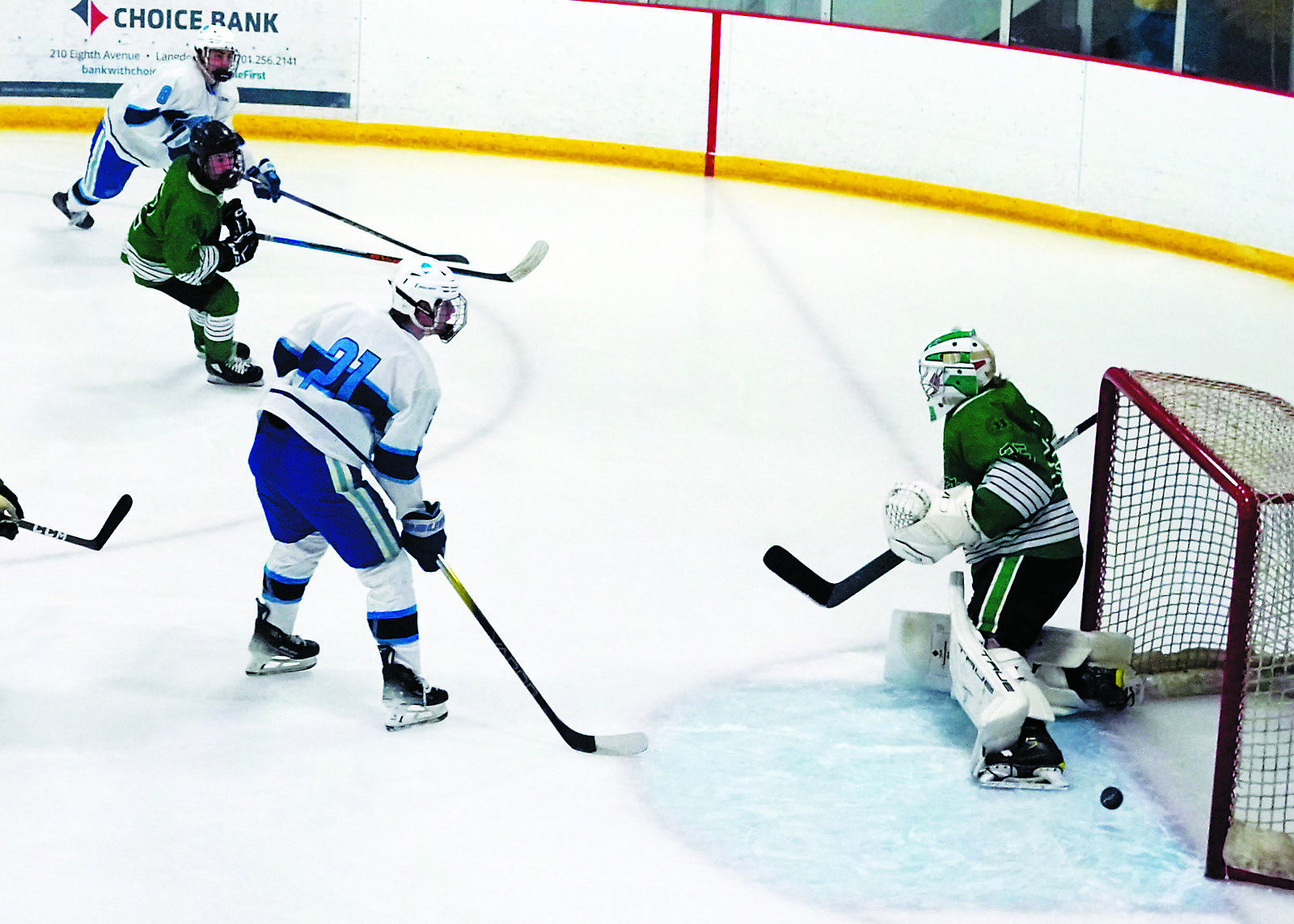 Devils Lake Royals #8 Brady Regner fires a shot from the right of the goalie and scores the first goal of the game against the UND Mens Club on Feb. 1. Photo by Larry Stokke.