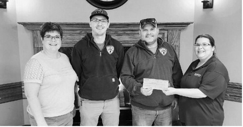 Jace Peterson and Darren Paulson of the Starkweather Fire Protection District accepted a $500 donation from Horizon Financial Bank and its board of directors. Presenting them with the check is Lori Peterson and Kyra Scott of Horizon Financial Bank.