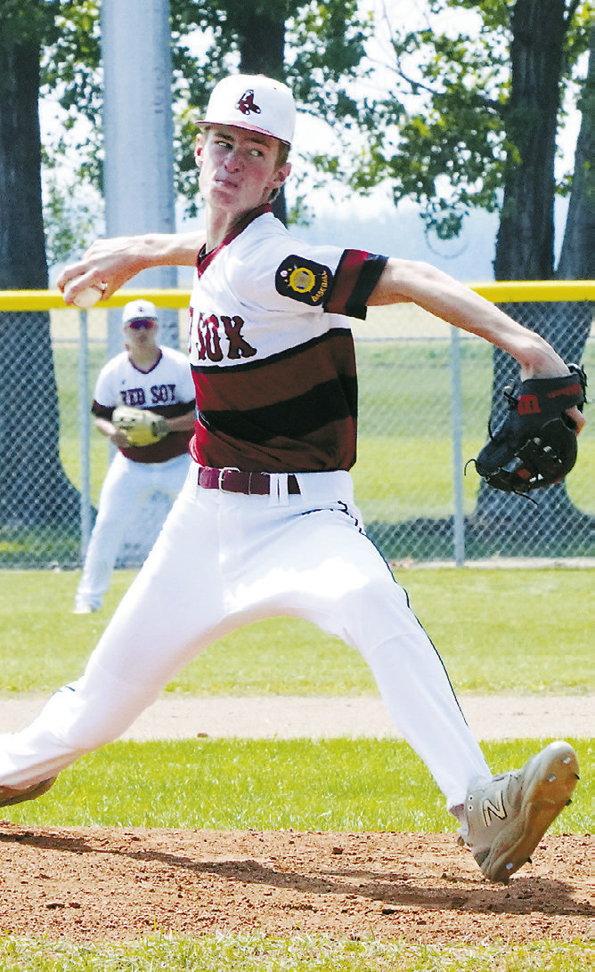 Tyson Gemmill winds up and sends a strike over the plate against Park River. Photo by Larry Stokke.