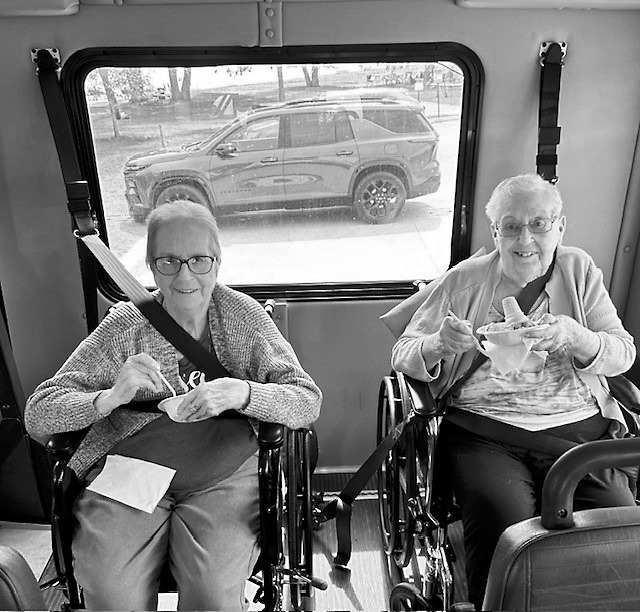Darlene and Gerry eating ice cream on the bus at Icelandic State Park.