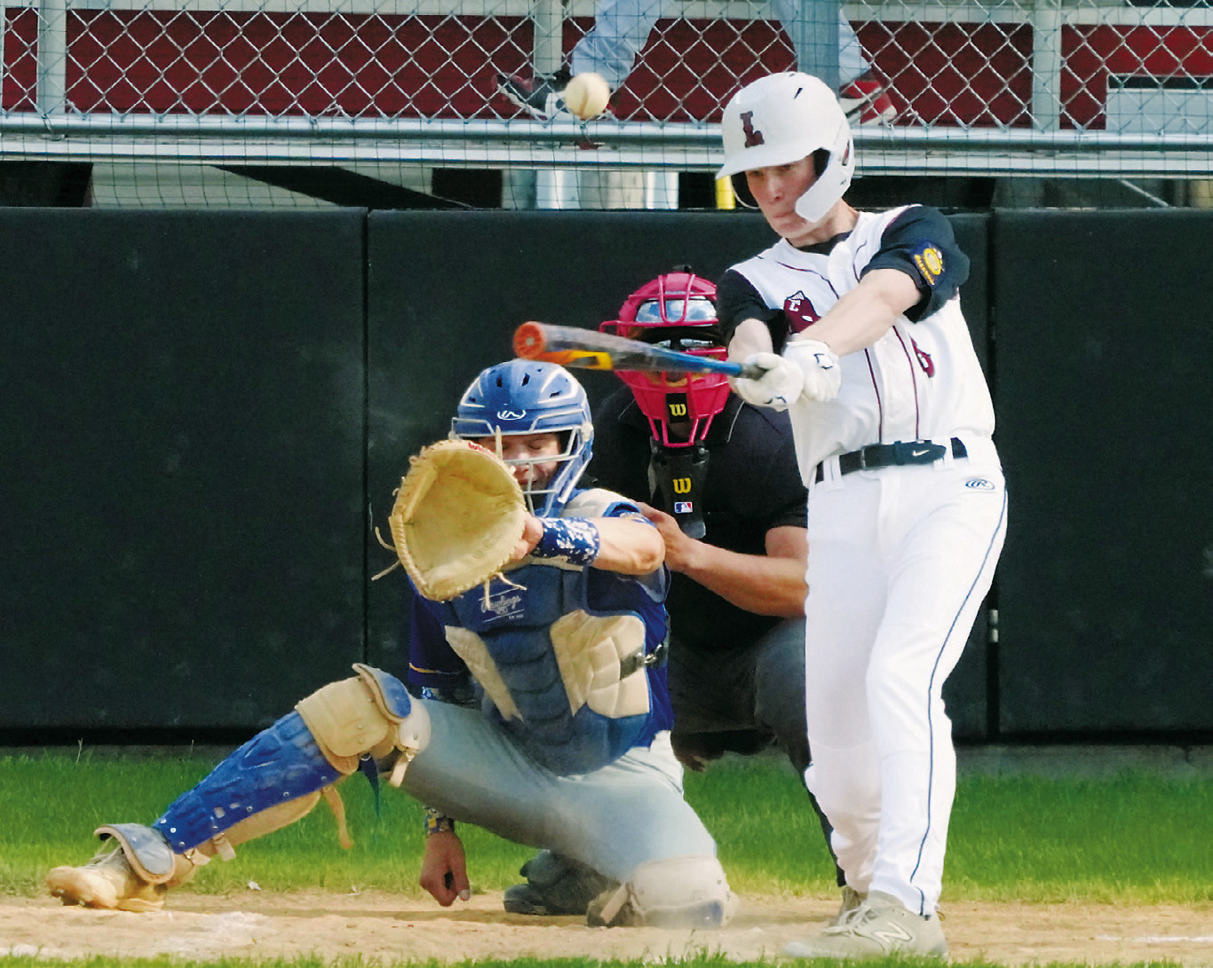 Tyson Gemmill connects with the ball and gets a base hit against Hatton/Northwood. Photo by Larry Stokke.