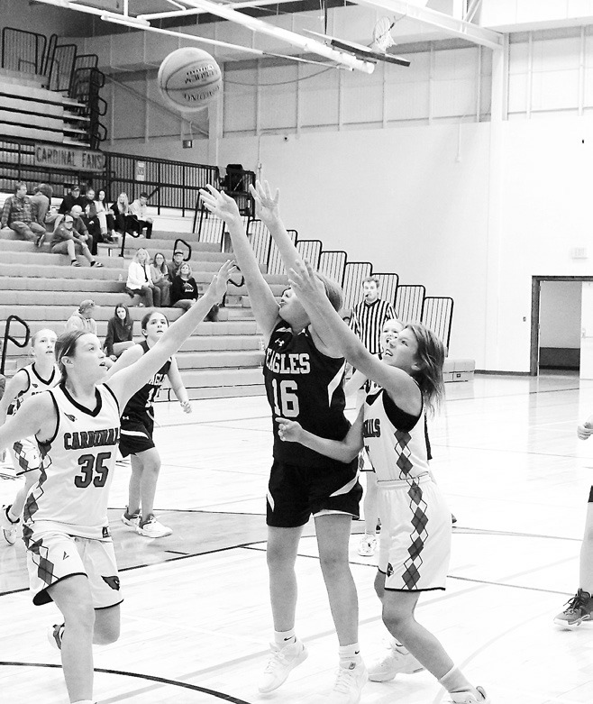 North Border Eagle Lauren Smith puts up a shot in the game against the Cards Aug. 6. Photo by Larry Stokke.