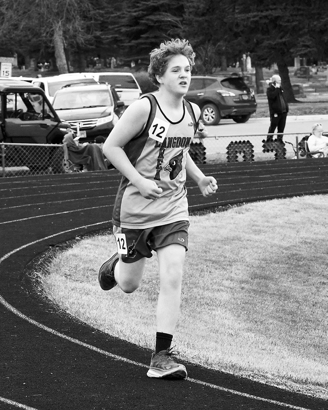 William Foster had a great run in the 800 meter at the Langdon Invitational on April 24. Photo by Larry Stokke.