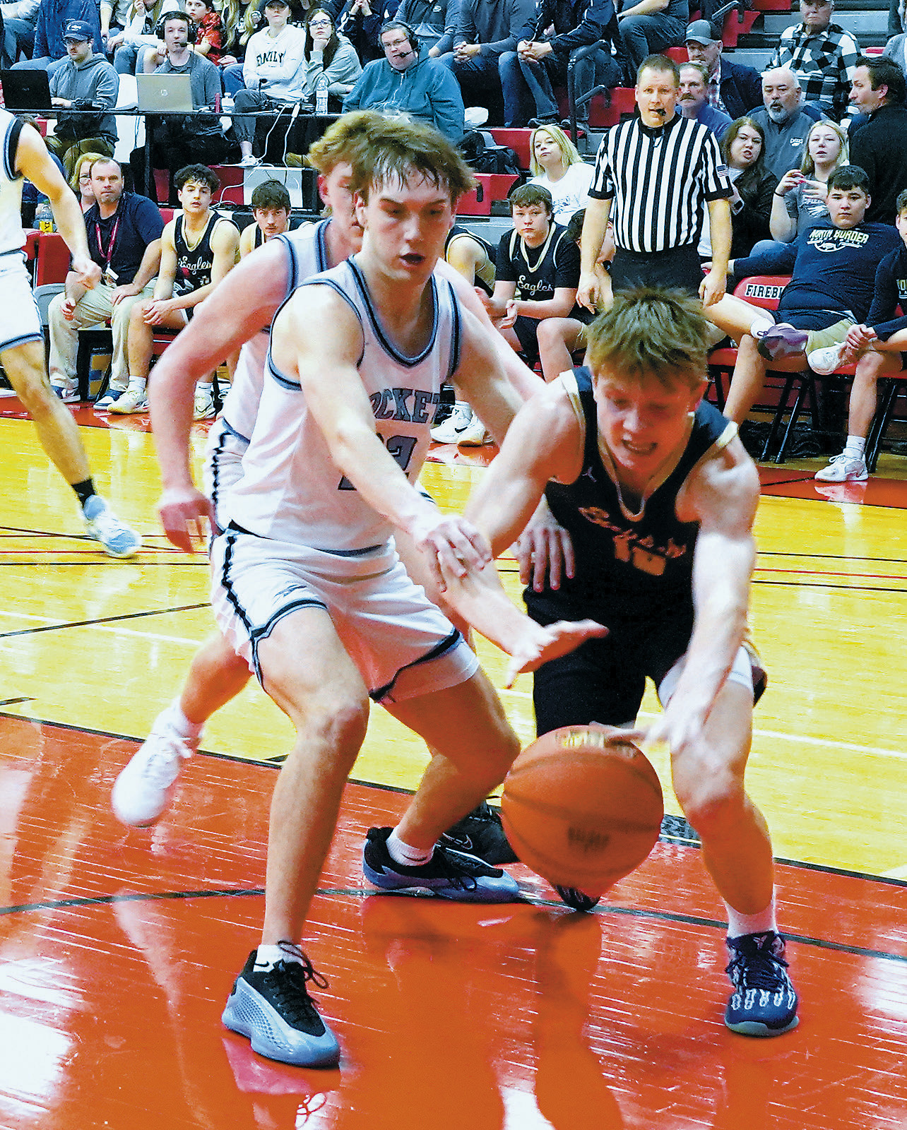 Garret Willits dives for a loose ball against the Rockets. Photo by Larry Stokke.