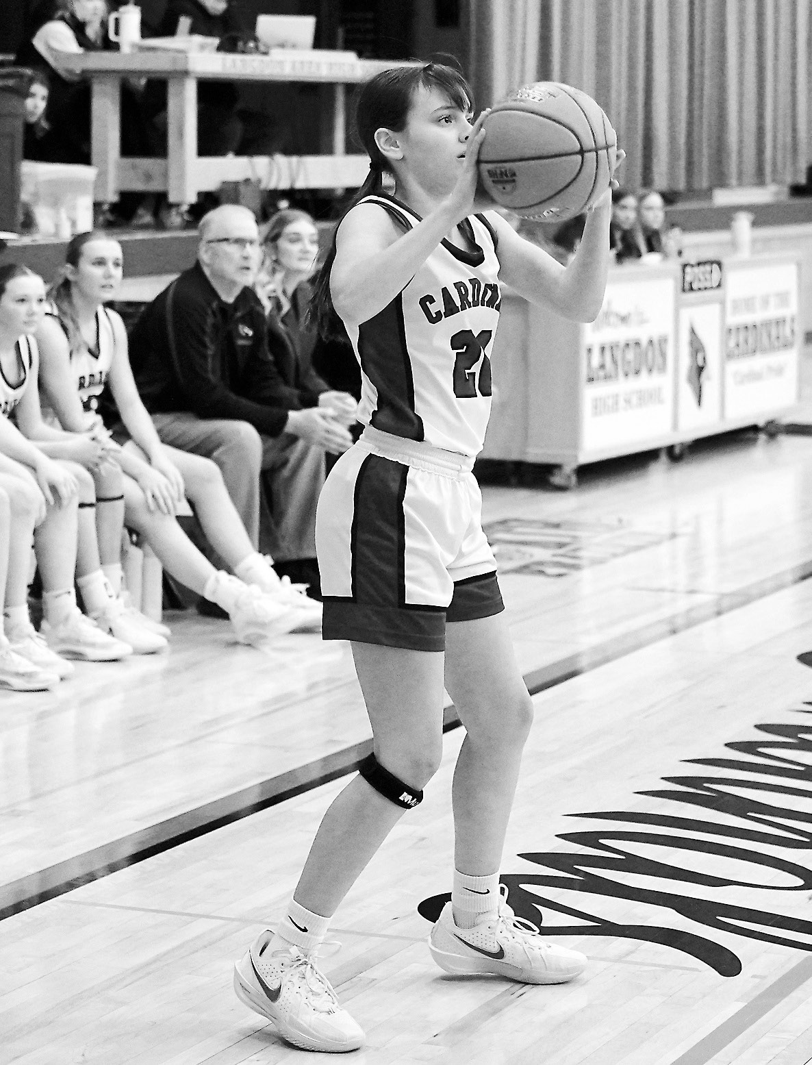 FM Bank's Player of the Game Hilary Haaven drains a shot and finished the Lily Zimmer nails a three point shot from beyond the line. Photo by Larry Stokke. game with seven points against Central Cass. Photo by Larry Stokke.