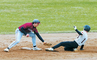 Mason Romfo tags out Ezra Robinson at 2nd base at the game on April 30. Photo by Larry Stokke.