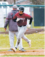 Theo Romfo rounds the bases after hitting a three-run homer. Photo by Larry Stokke.