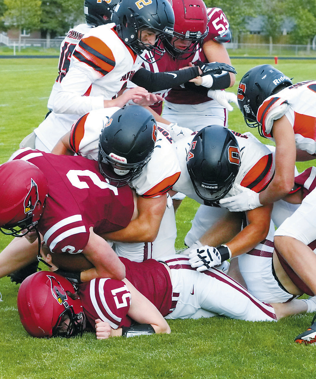 Keaton Ullyott opens up a hole in the Oaks' defense for Jax Johnson to dive over the goal line for a touchdown. Photo by Larry Stokke.