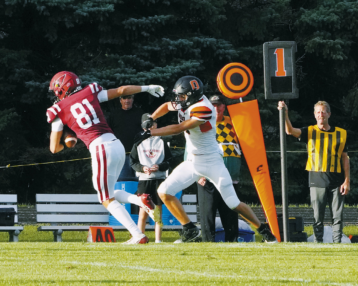 Tanner McDonald eludes an Oakes player to gain yardage. Photo by Larry Stokke.