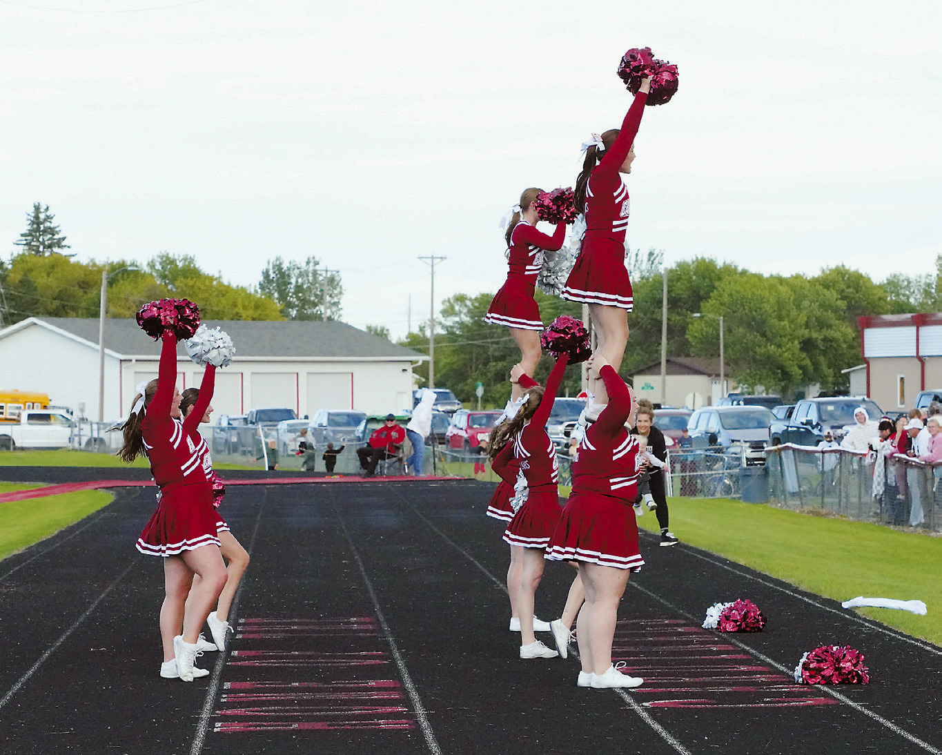 The Cardinal Cheer Squad kept the crowd fired up with nonstop cheering at Langdon's first game of the season. Photo by Larry Stokke.