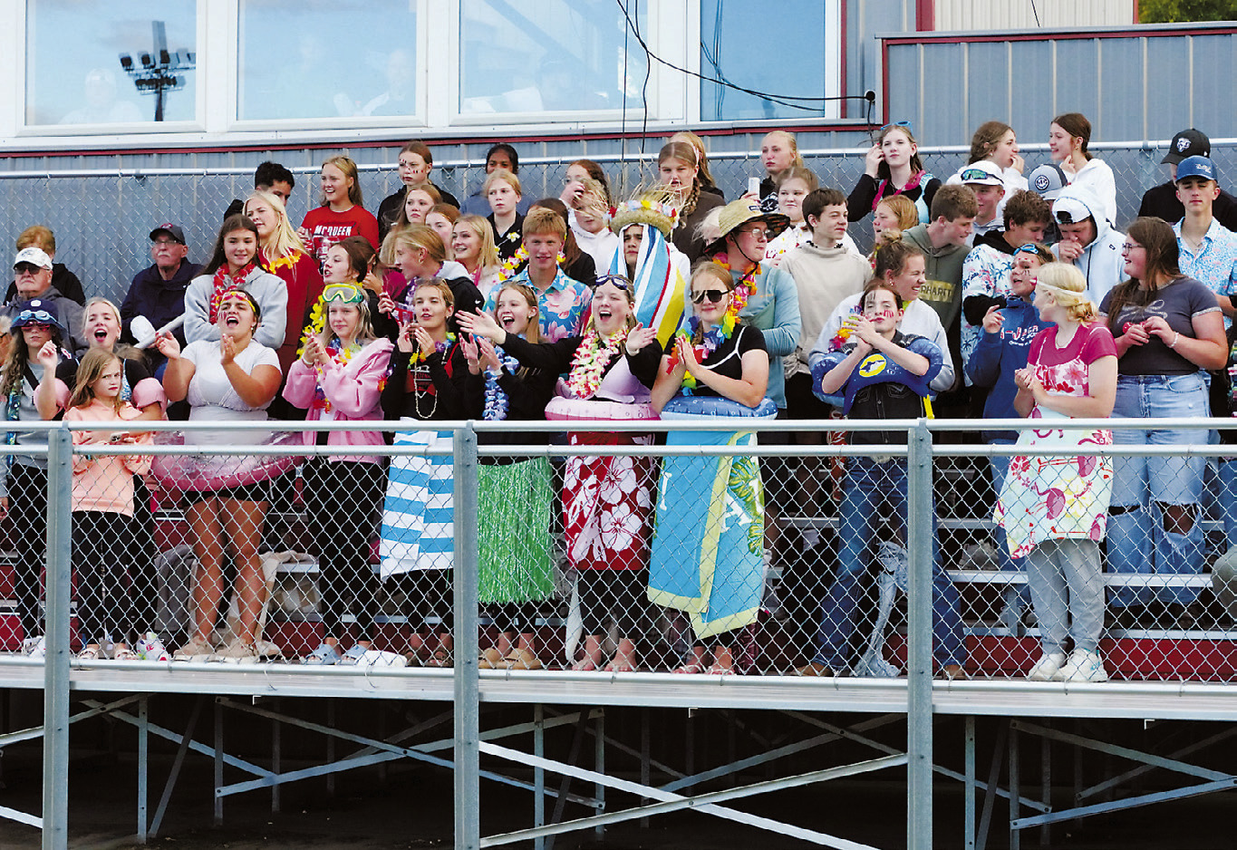 Langdon student fans cheering the Cards on to their first win of the year. Photo by Larry Stokke.