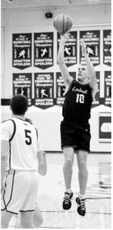 Maddux Stremick drops in a three-point basket and finished the night with 10 points. Photo by Larry Stokke