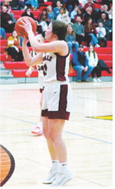 Erika Bakke sinks a 3-point basket in the game with New Rockford-Sheyenne. Photo by Larry Stokke