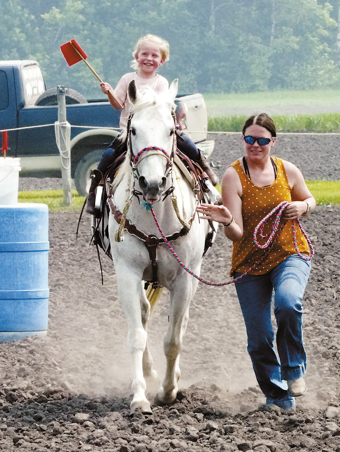 Taylor Linegard leading her daughter Reece in the flag race at Sapa Arena June 1. Photo by Larry Stokke.