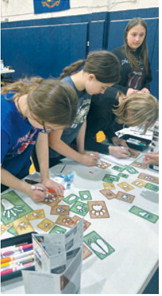 Elementary students work together at one of many STEM stations provided by the North Dakota Gateway to Science Center. The activities offered opportunities to experiment, create and learn through exploration. Submitted photo