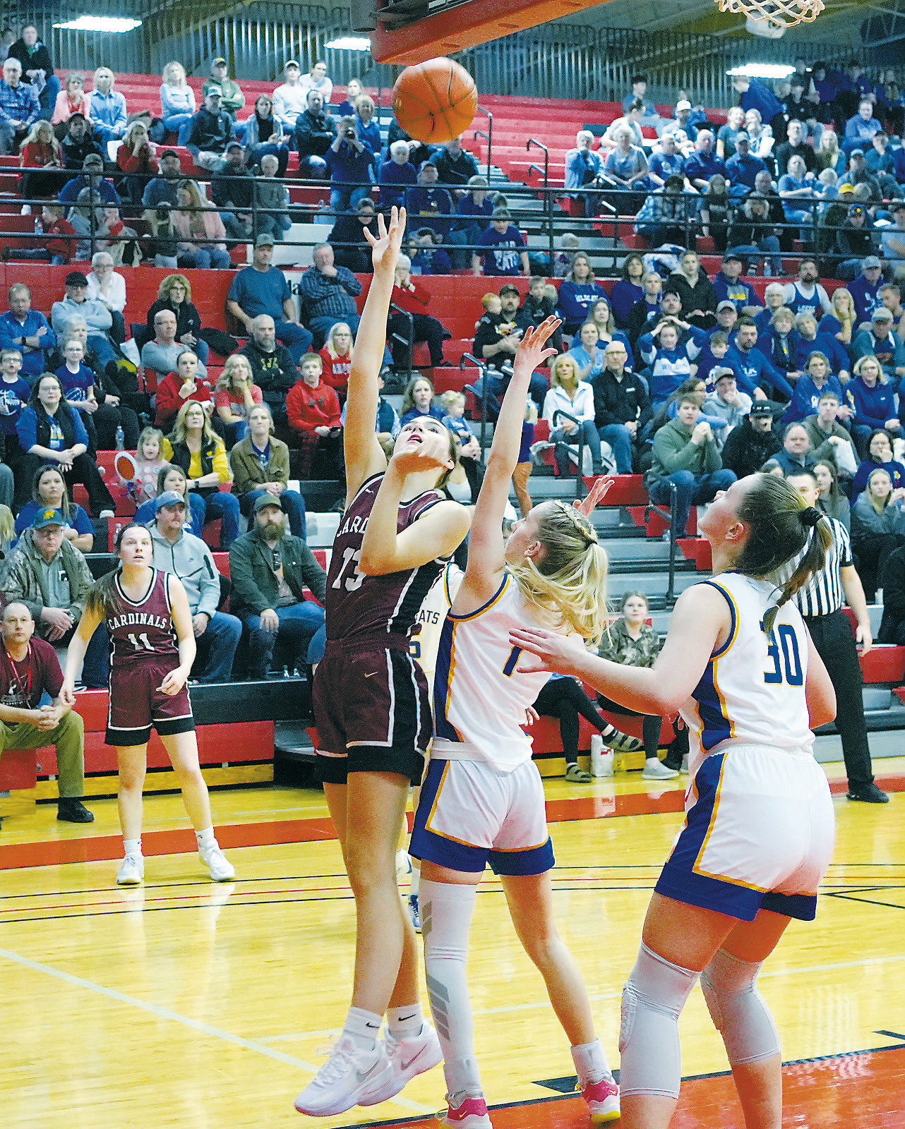 Taya Feist gets fouled, sending her to the free throw line where she drops in a basket in the win over Benson County. Photo by Larry Stokke.
