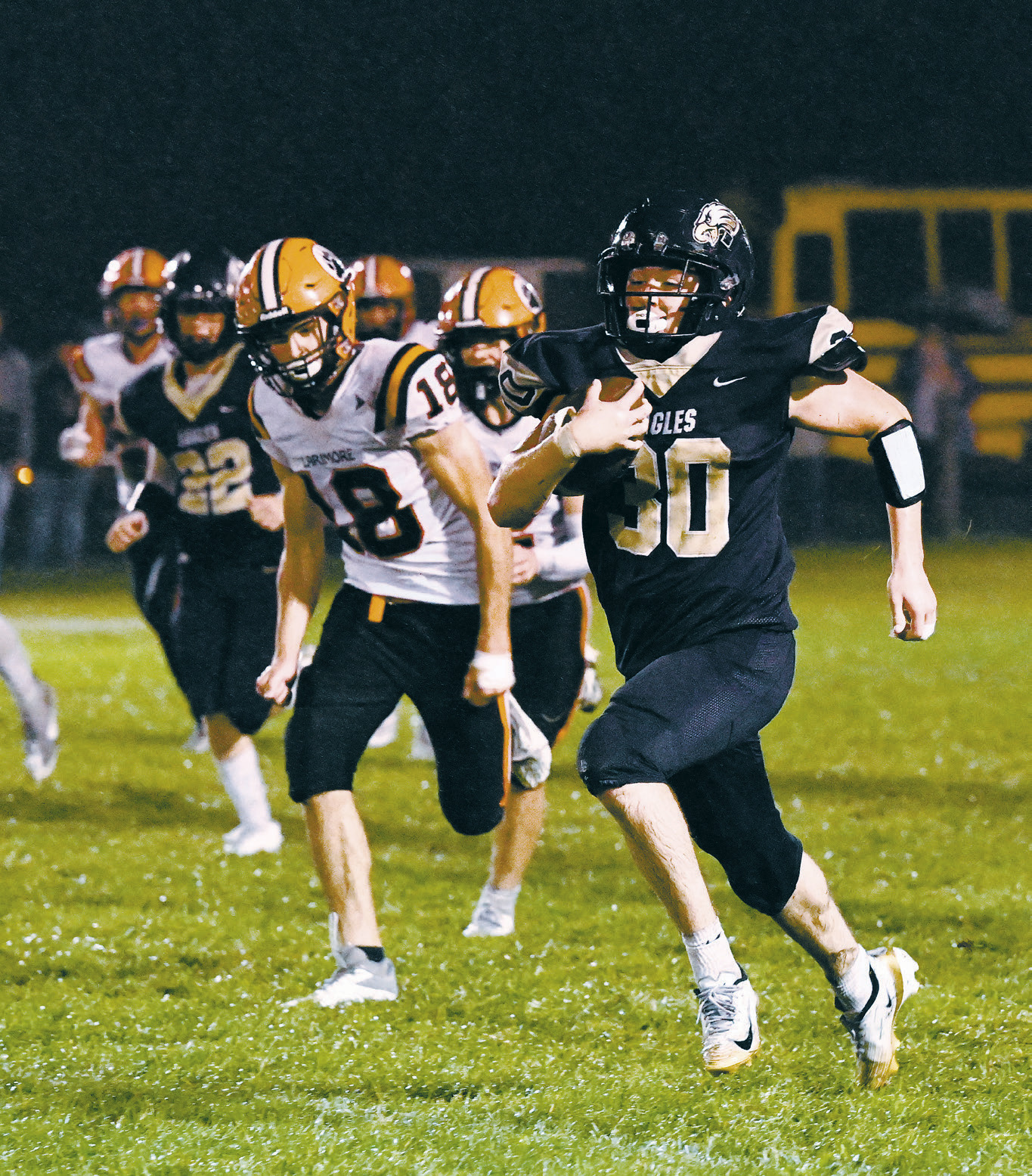 Brody Berg finds space and gains yards on the play. Photo by Ashley Schafer.