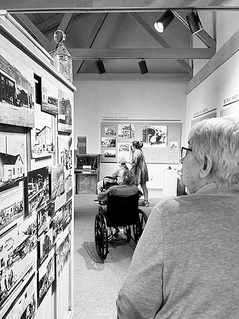 The ladies strolling throughout the museum.