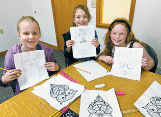 (L-R) Stella Norell, Emma Ratchenski, and Ruby Morrison had so much fun drawing their owls.
