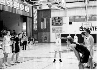FM Bank Player of the Game Connor Mitchell, with little time left on the clock, calmly went to the line and drilled two free throws- assuring the Cards victory against Nelson County. Photo by Larry Stokke
