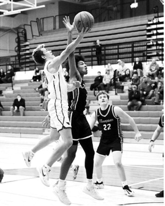 FM Bank Player of the Game Maddux Stremick had three 3-point baskets and 16 points in the home game against Thompson. Photo by Larry Stokke