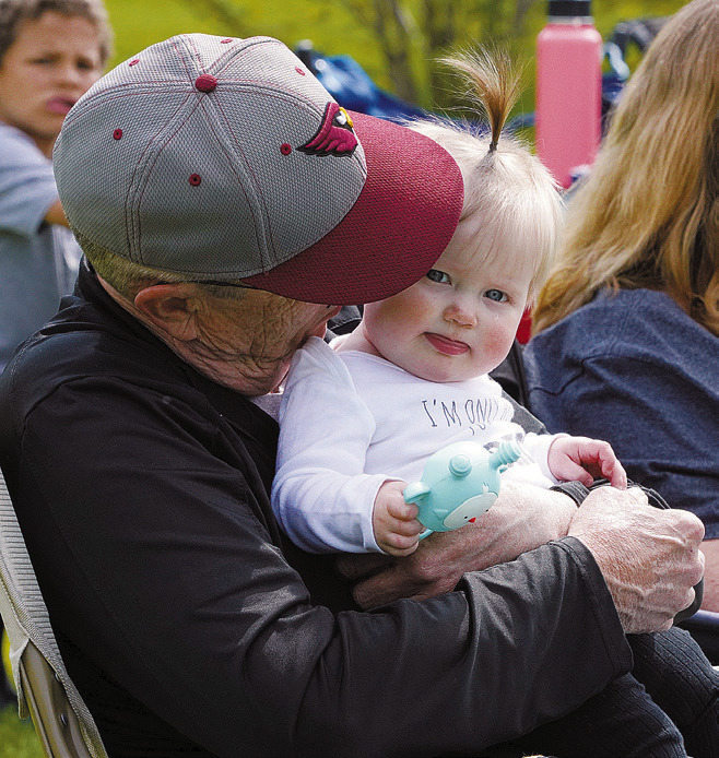 Coach Groth's little girl and her grandpa were present to cheer on the Cards. Photo by Larry Stokke.