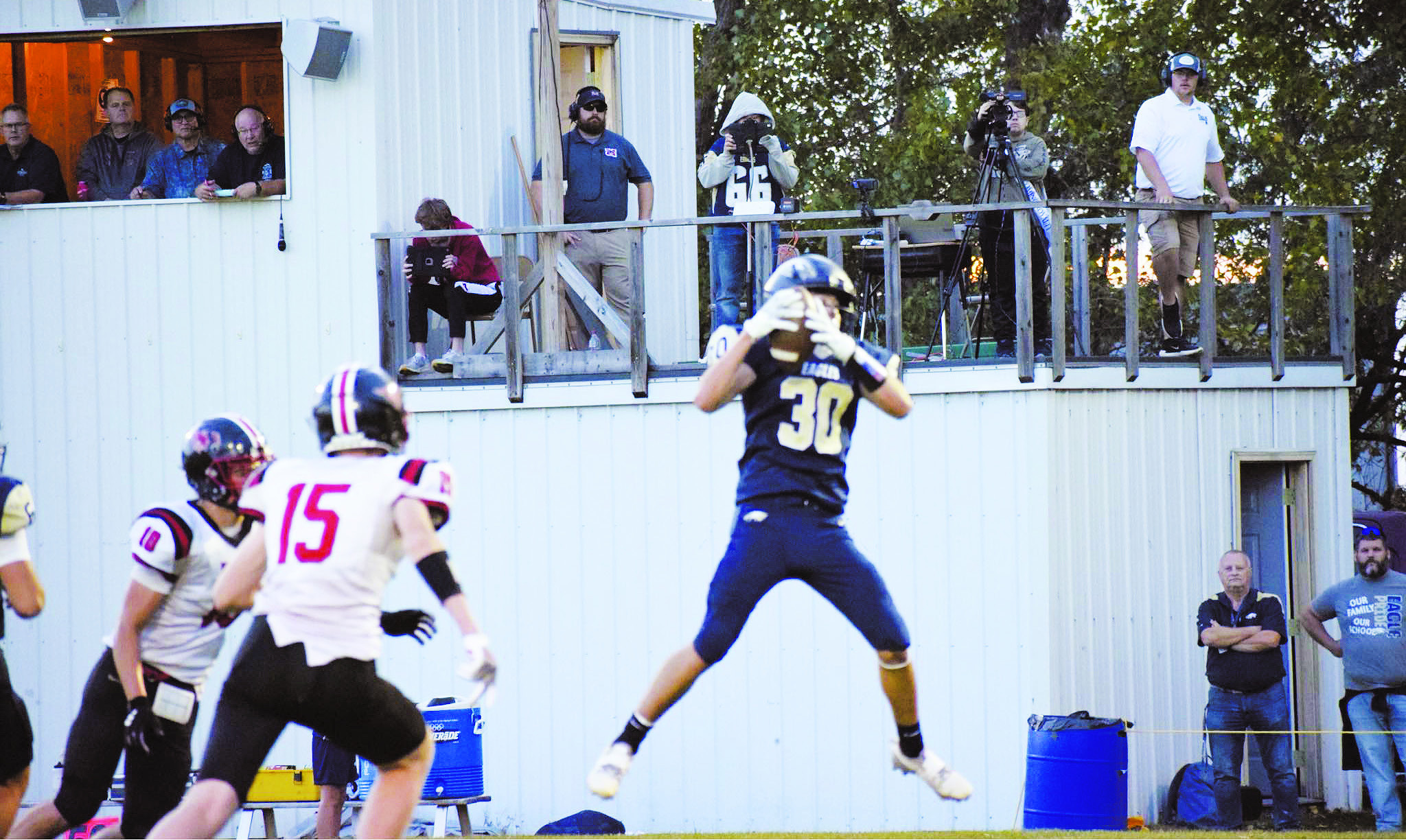 Brody Berg leaps to make a catch at the Eagles homecoming game last Saturday. Photo by Rebecca Davis.