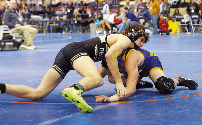 Logan Werner wrestled his man to a close decision loss in 133 lbs. class. Photo by Larry Stokke.