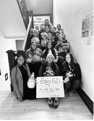 St. Alphonsus principal and teachers are pictured with painted pumpkins they received as gifts in the fall. Submitted photo