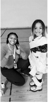 Mrs. Okwudili is pictured participating in a team building activity with students around Halloween. Submitted photo