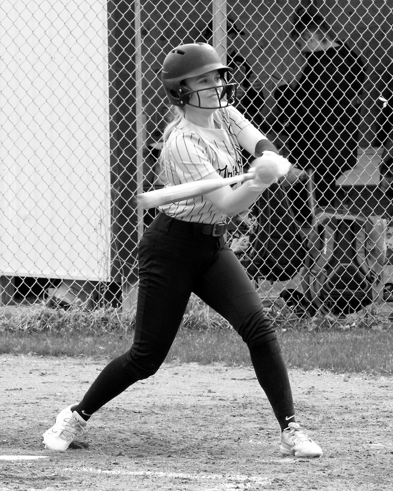 Hannah Russell connects for a base hit against the Mustangs. Photo by Larry Stokke.