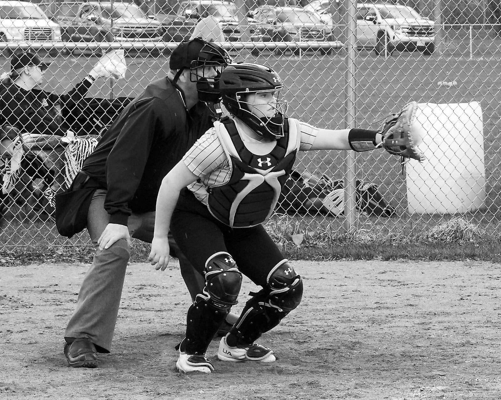 North Border player Mady Steele with a catch behind the plate against Midway-Minto on May 1 in Minto. Photo by Larry Stokke.