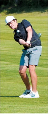 Langdon Area/Munich golfer Ryder Moser chips the ball toward the green during the North Dakota State Golf Tournament on June 2. Photo by Larry Stokke