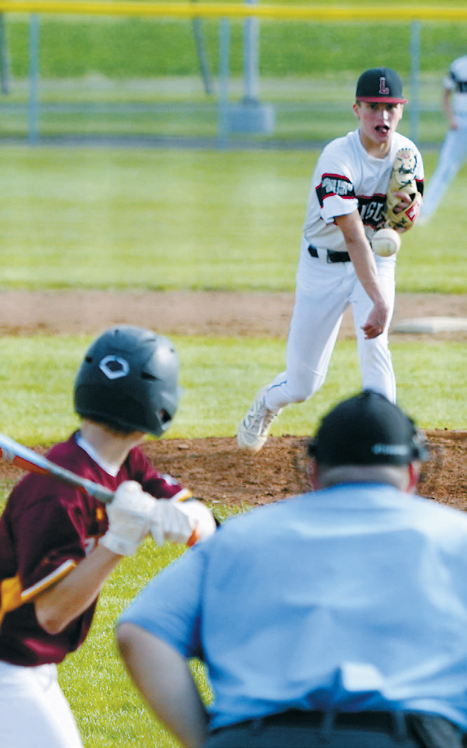 Finn Lorenz delivers a pitch to the plate during Langdon's game against Grafton. Photo by Larry Stokke