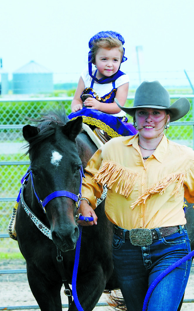 A young competitor takes part in the 4H horse show. Photo by Larry Stokke.