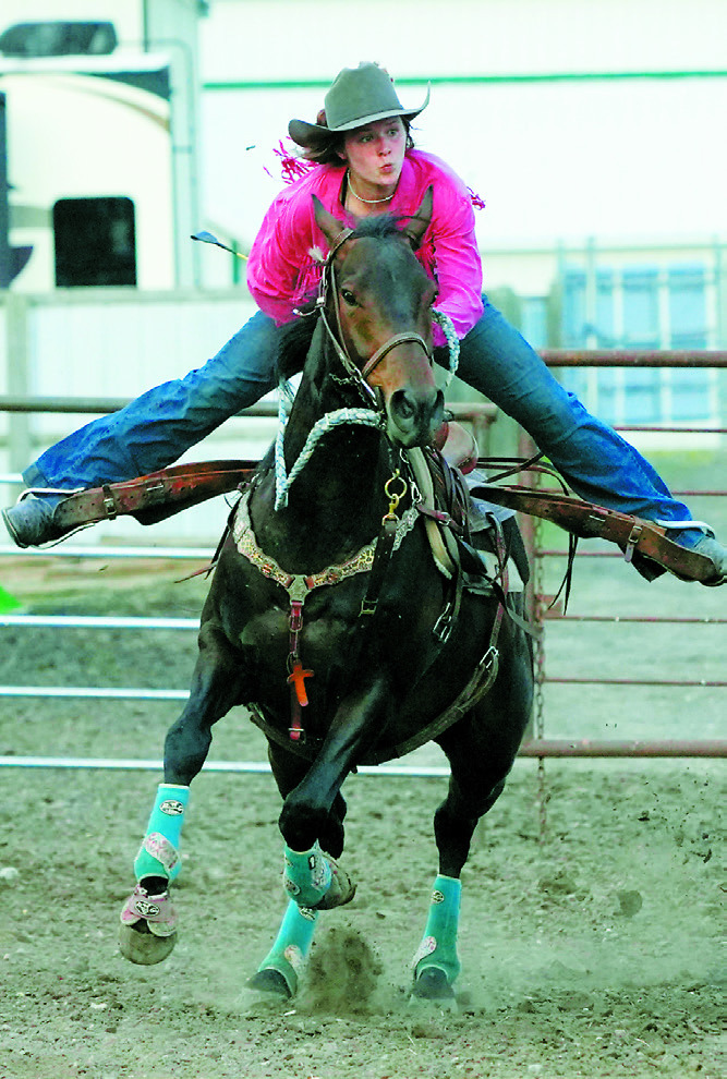 A competitor trying their luck at barrels in the 4H horse show at the Hamilton Fair. Photo by Larry Stokke.