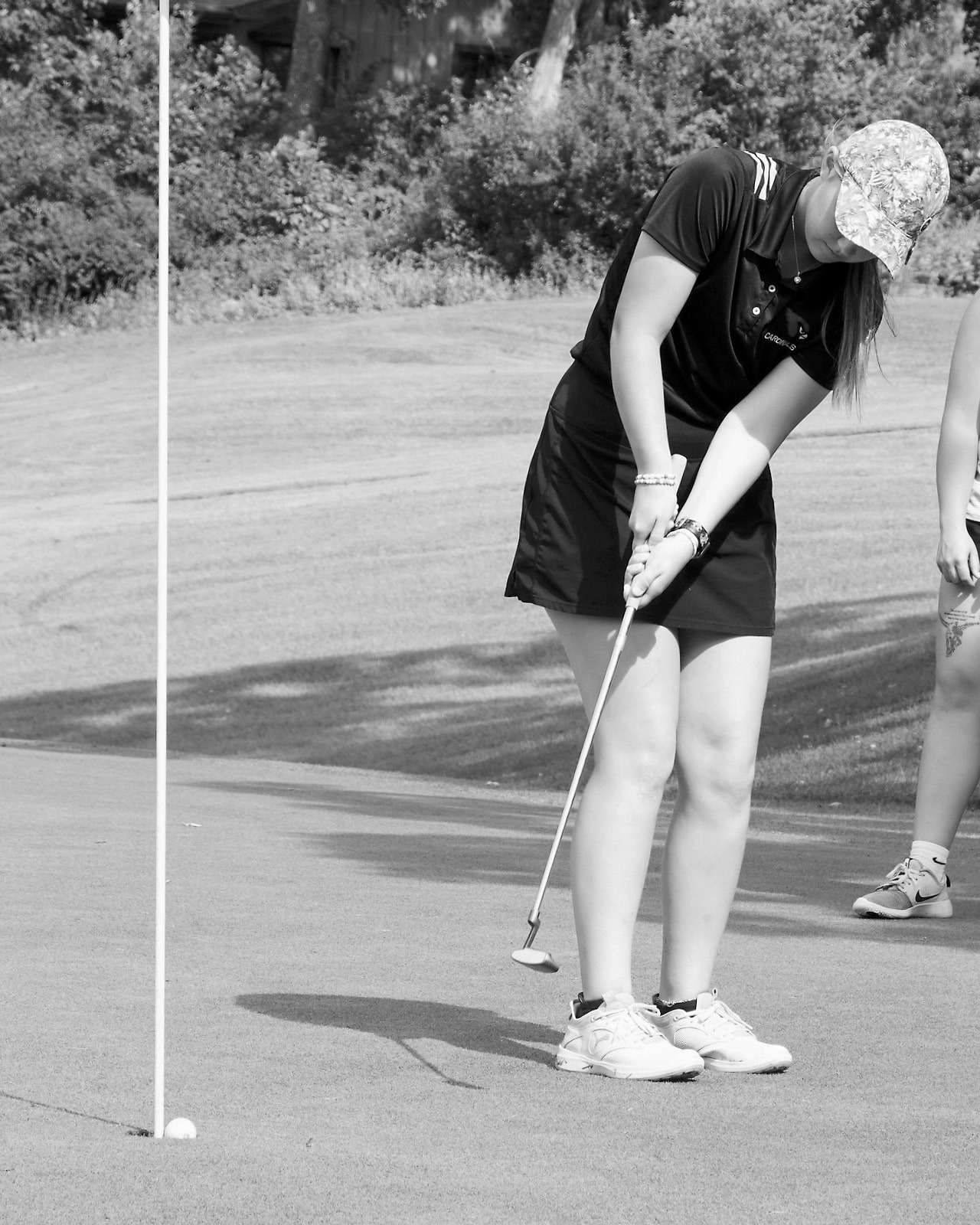 Nadia Lewis sinks a put in Park River on Aug. 14 and finished the day with a 104 score. Photo by Larry Stokke.