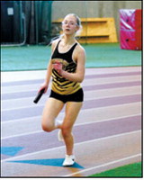 Eliot Peterson, along with teammates Gracelynn Moe, Brystol Homstad and Emma Seng, placed seventh in the 4x300 relay. Photo by Larry Stokke.